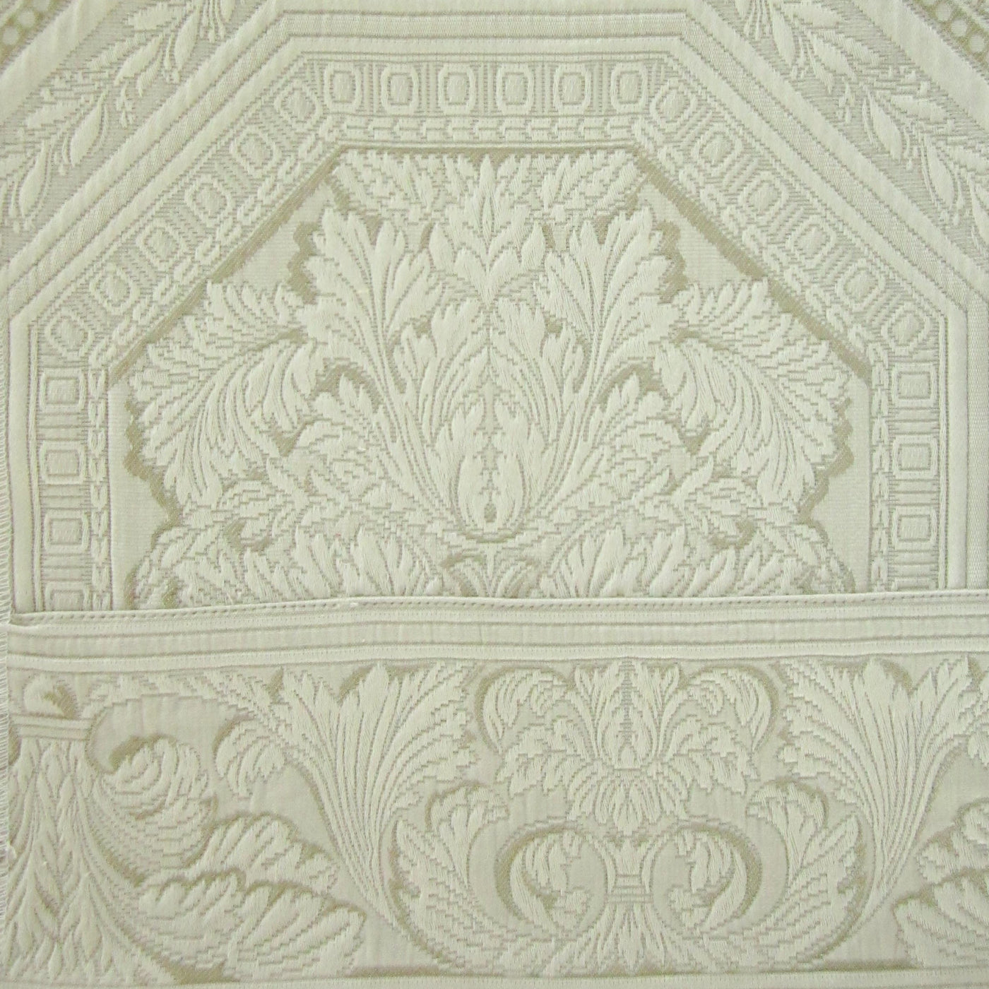 Close-up of ivory damask acanthus leaf motif on Home Treasures Olympia sham.