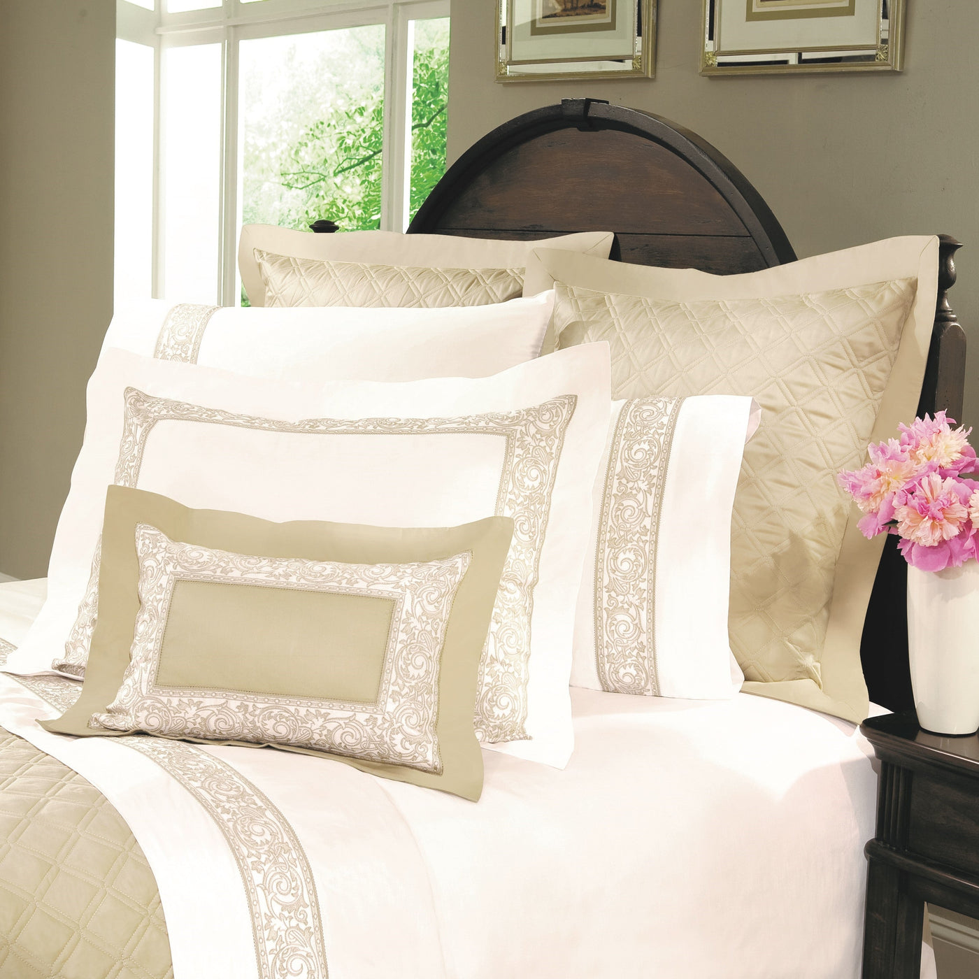Close-up of Home Treasures Paris pillowcase in ivory with champagne embroidered border trim.