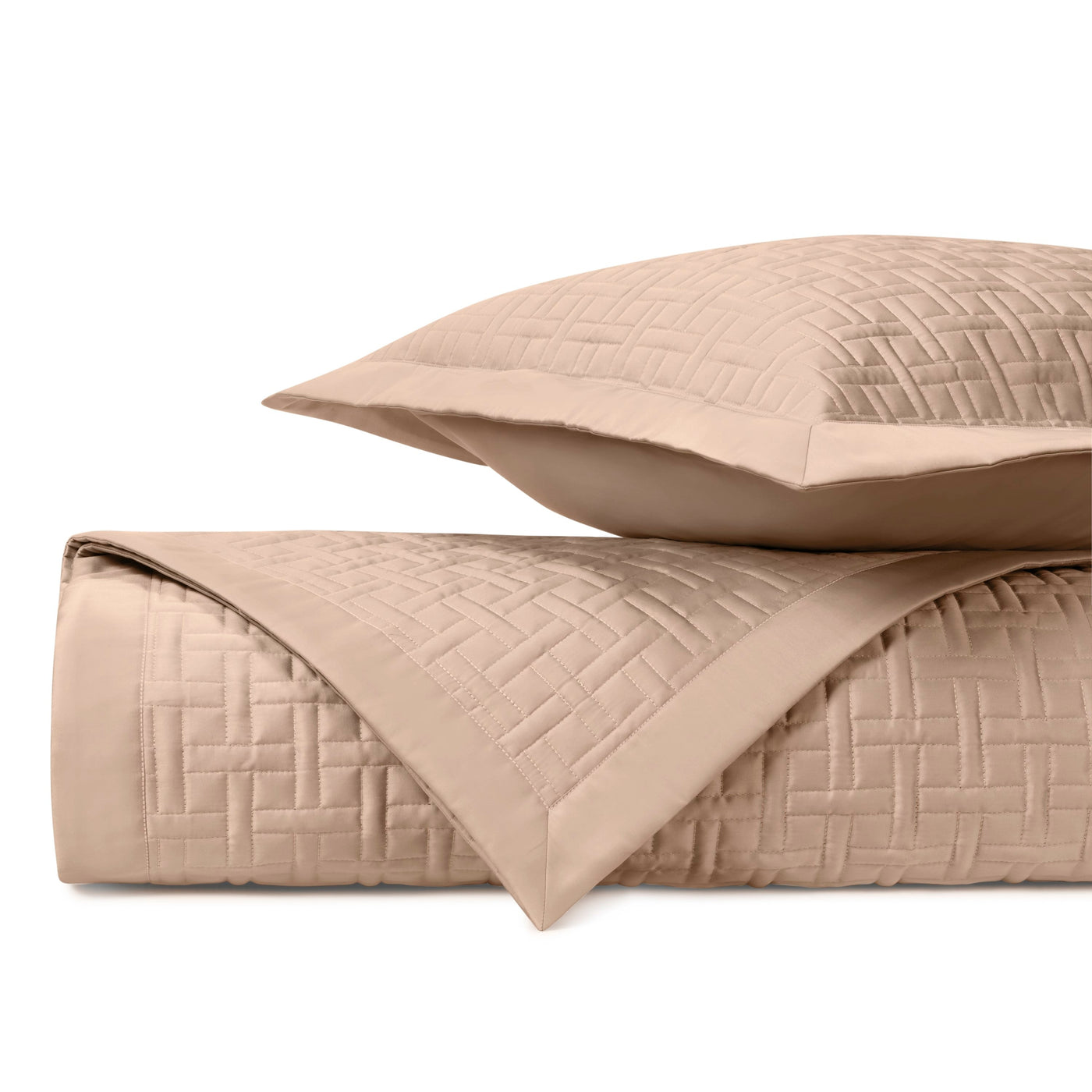 Parquet quilted coverlet and sham in camel, showing basket-weave stitching detail.