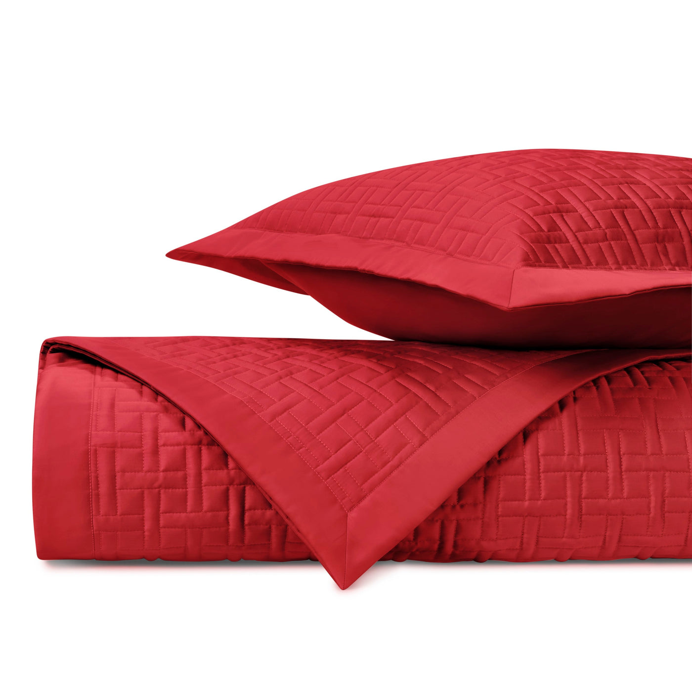 Close-up of crimson quilted parquet-stitched fabric with geometric basketweave pattern.