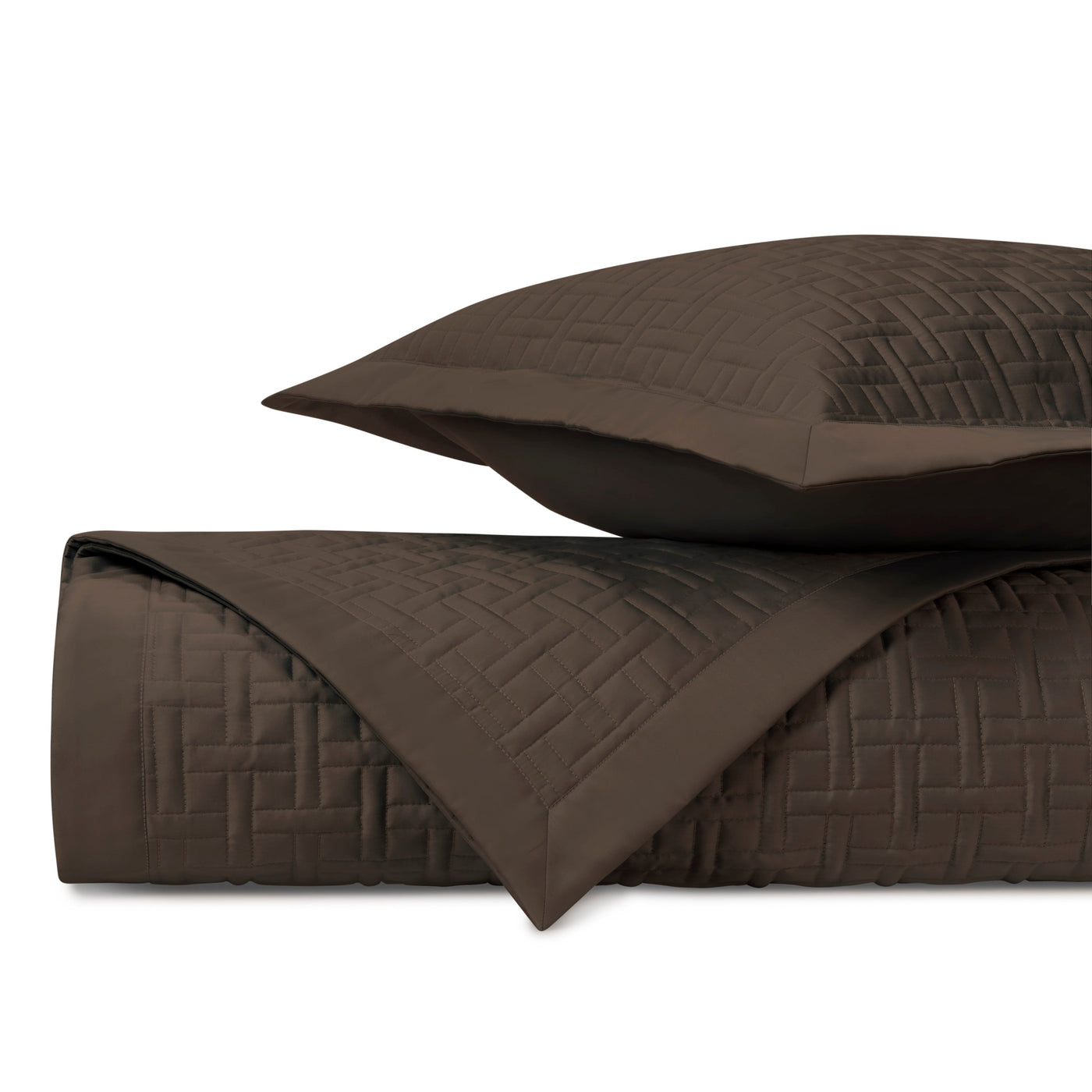 Close-up of Home Treasures Parquet quilted coverlet in chocolate with geometric basketweave stitching.