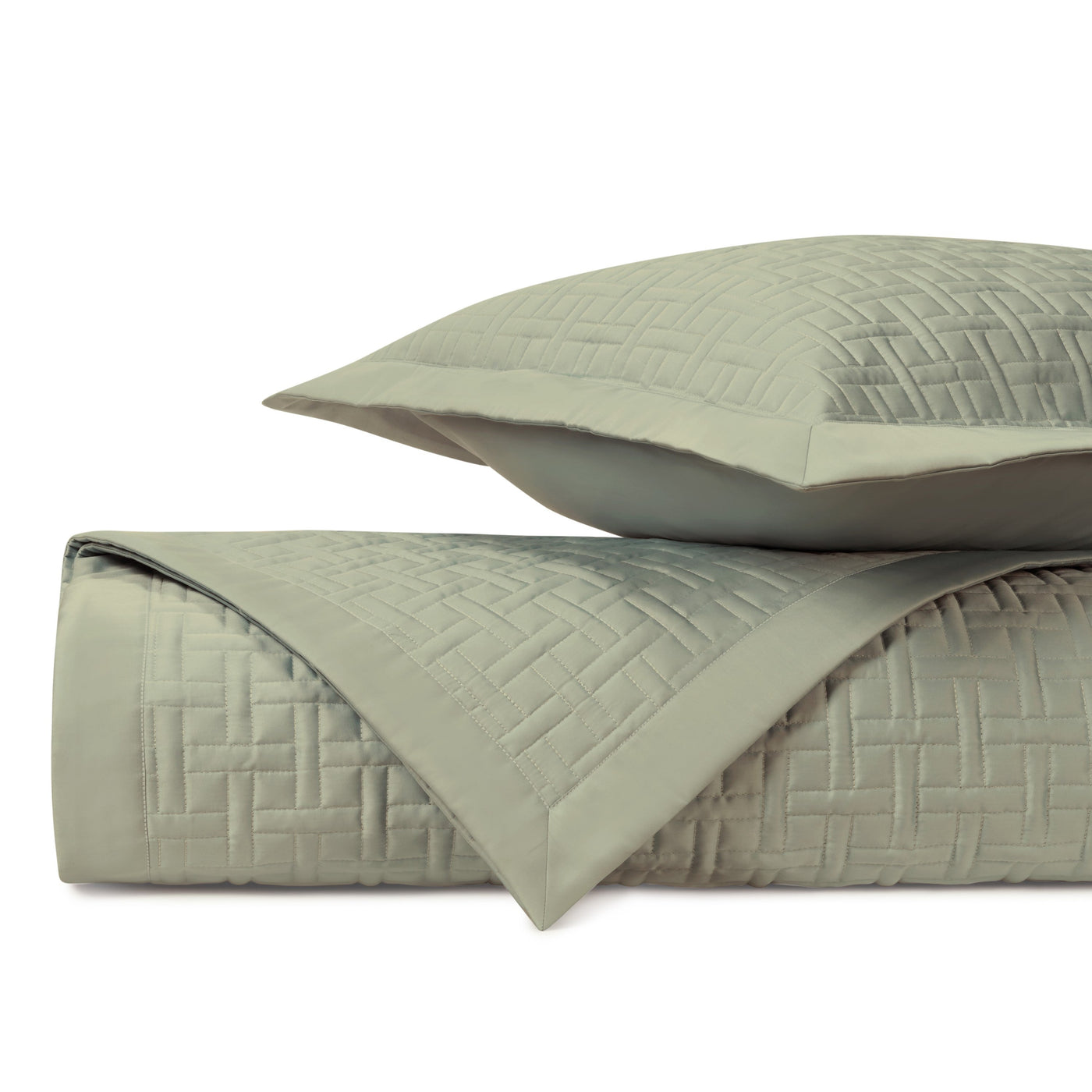 Close-up of sage quilted basketweave stitching on Home Treasures Parquet coverlet and sham.