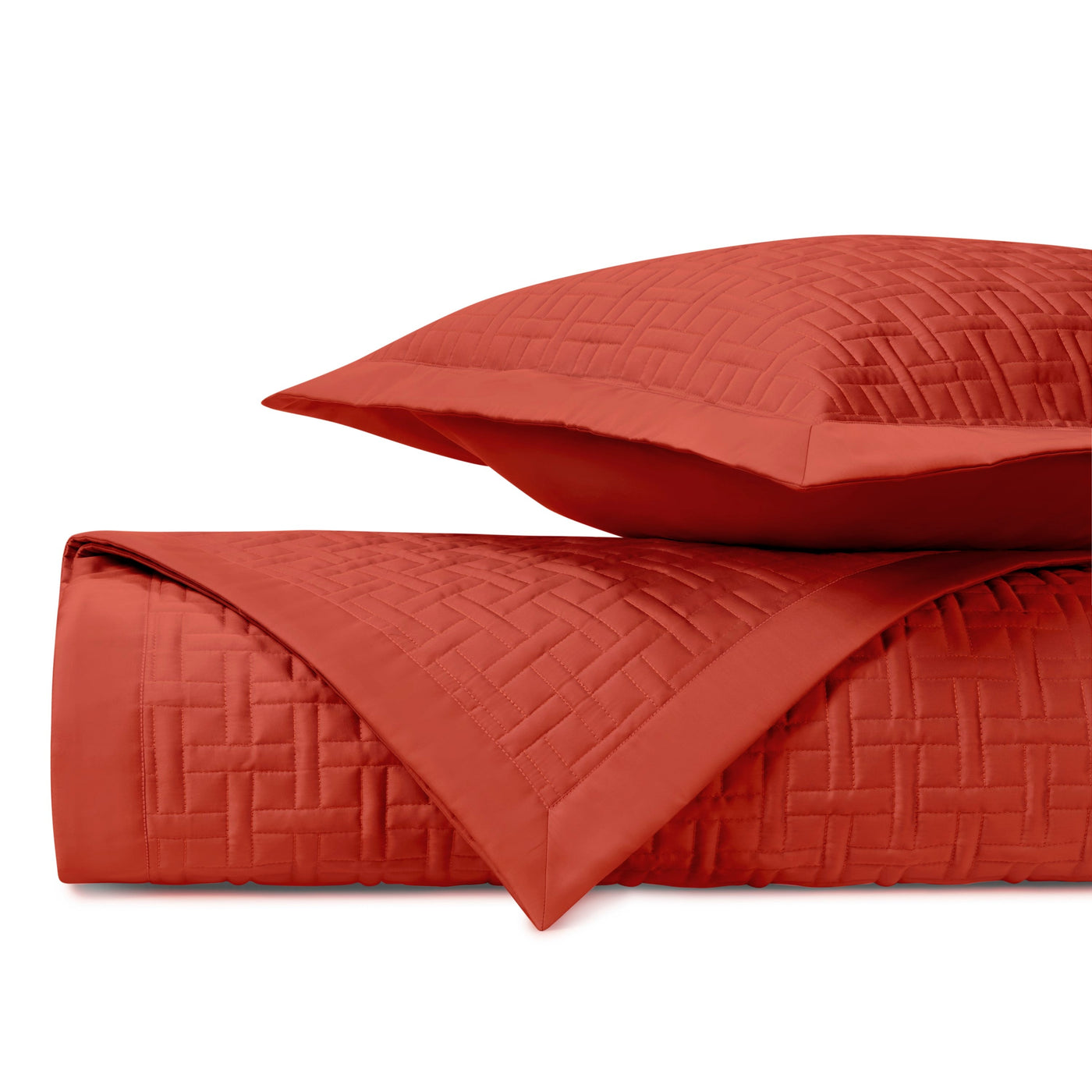 Close-up of Home Treasures Parquet quilted coverlet in tomato red with basket-weave stitching.