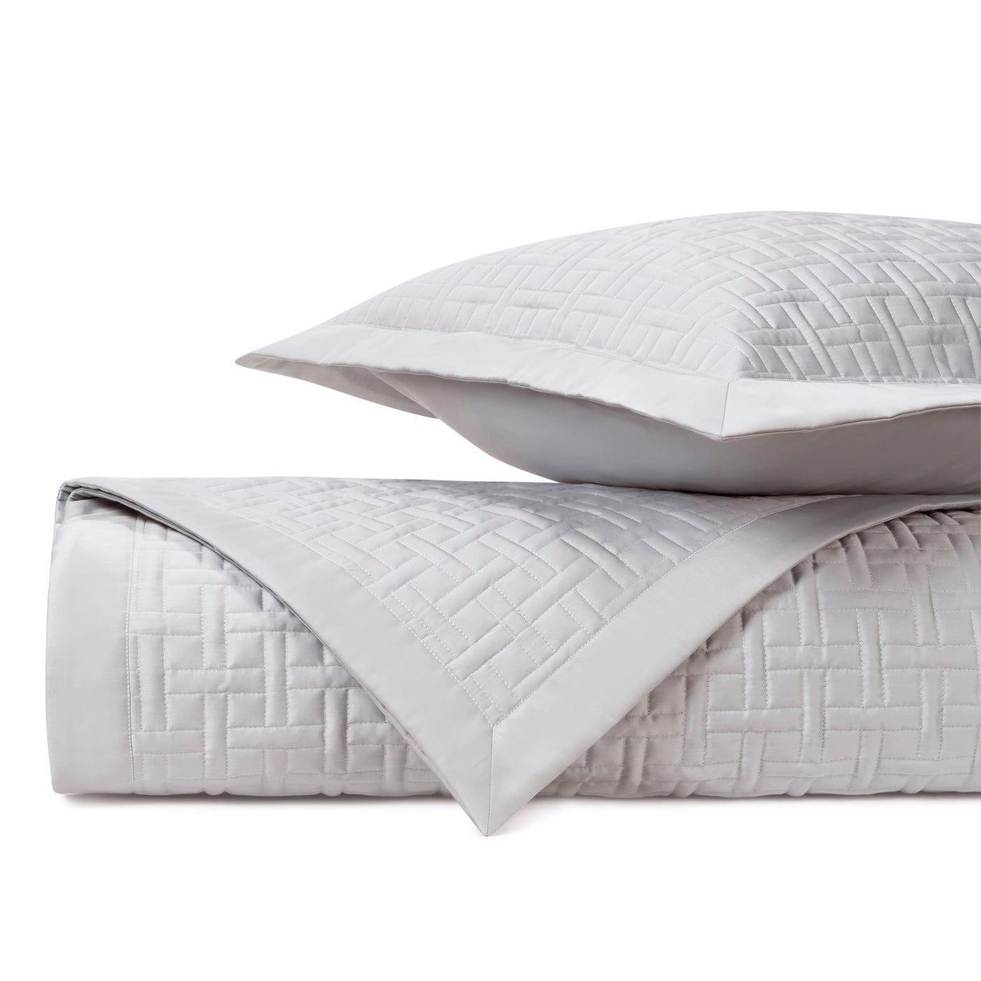 Close-up of Home Treasures Parquet quilted cotton in white with basket-weave stitching.