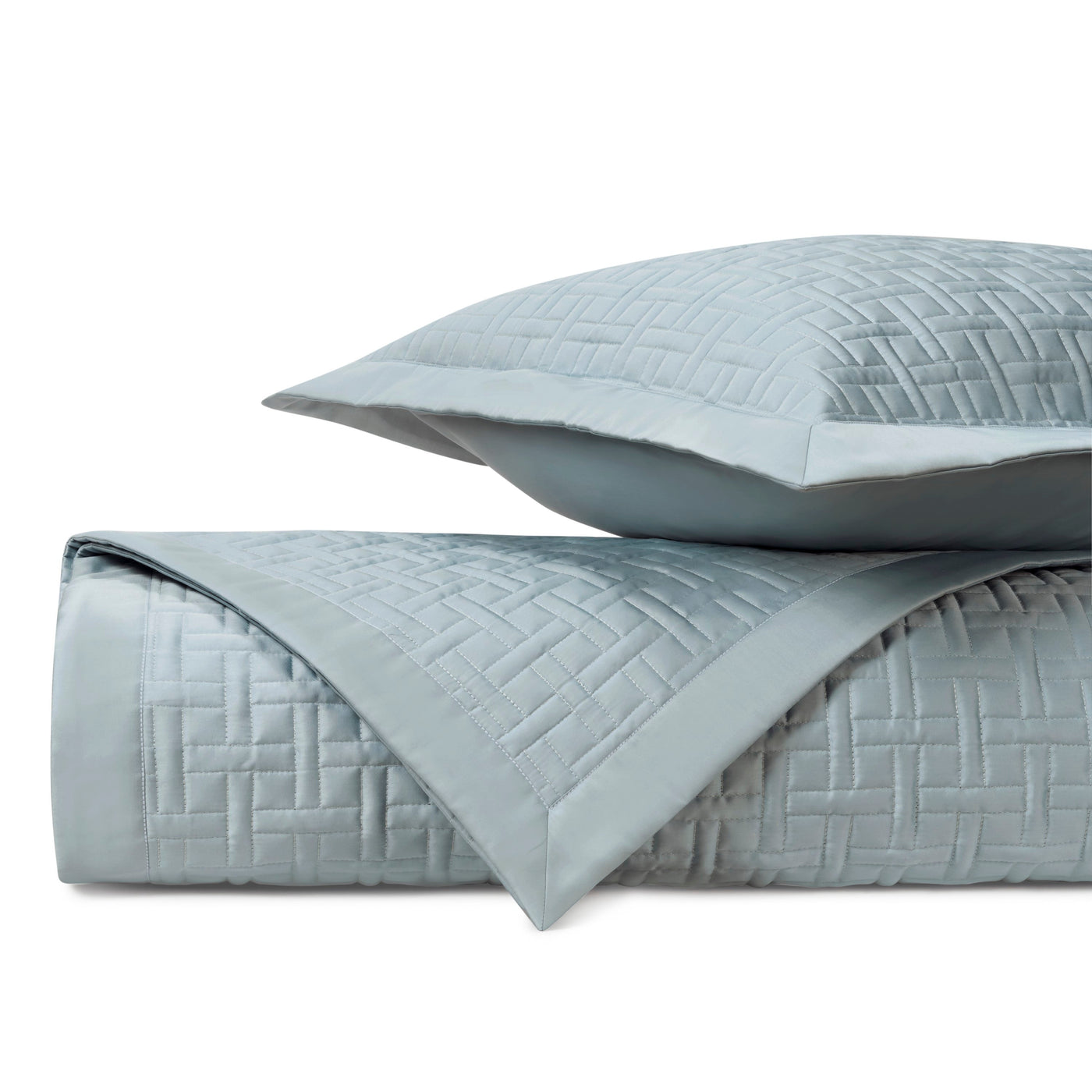 Close-up of Home Treasures Parquet quilted texture in mist blue with basket-weave stitching.