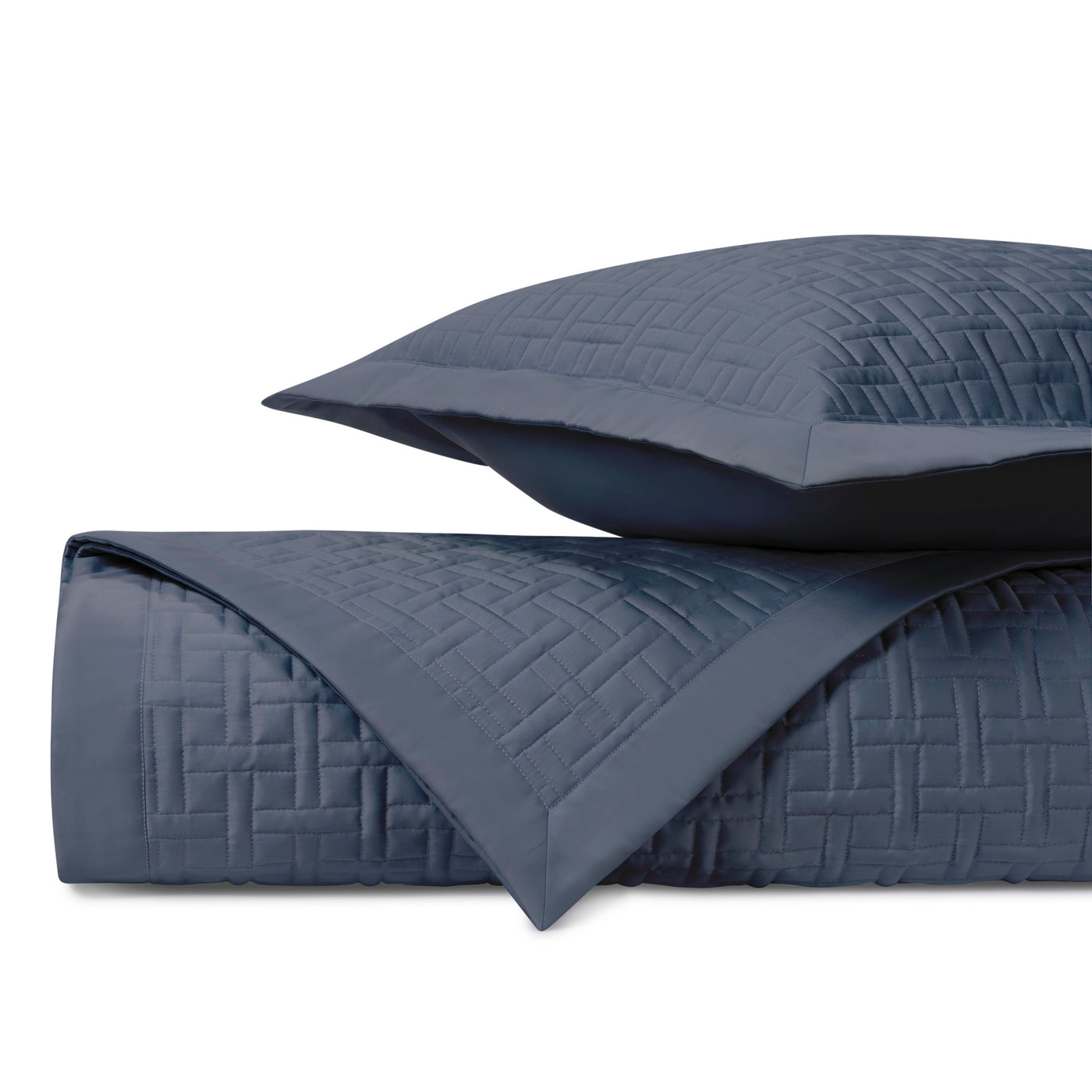 Close-up of Home Treasures Parquet navy quilted texture with geometric basketweave stitching.