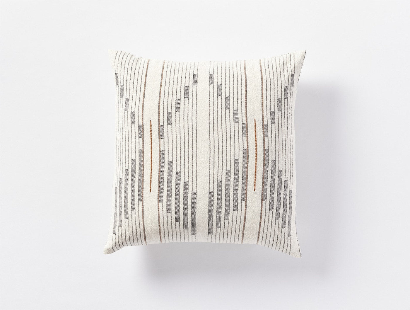 Coyuchi Morelia decorative pillow in ivory with gray and rust woven stripe pattern.