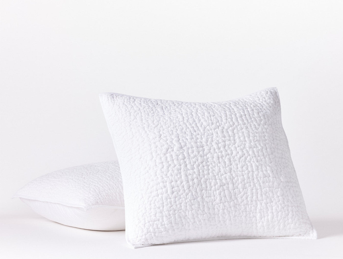 Coyuchi Pebbled Handstitched pillow sham in white with textured quilted surface.