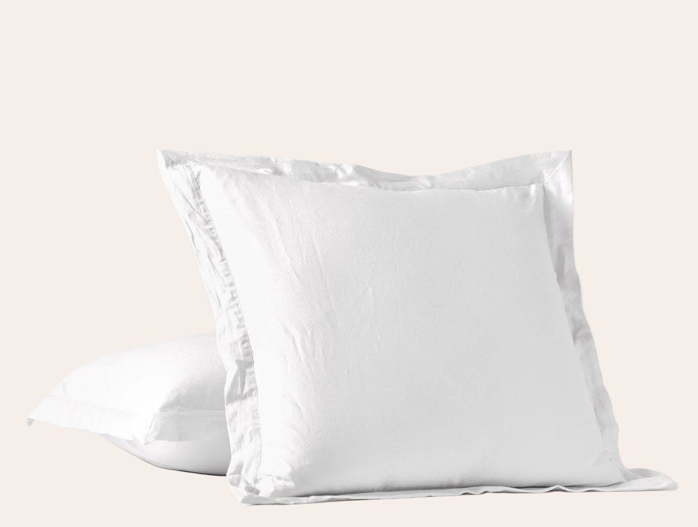 Two white Coyuchi Cloud Soft Sateen shams stacked, showing flange border detail.