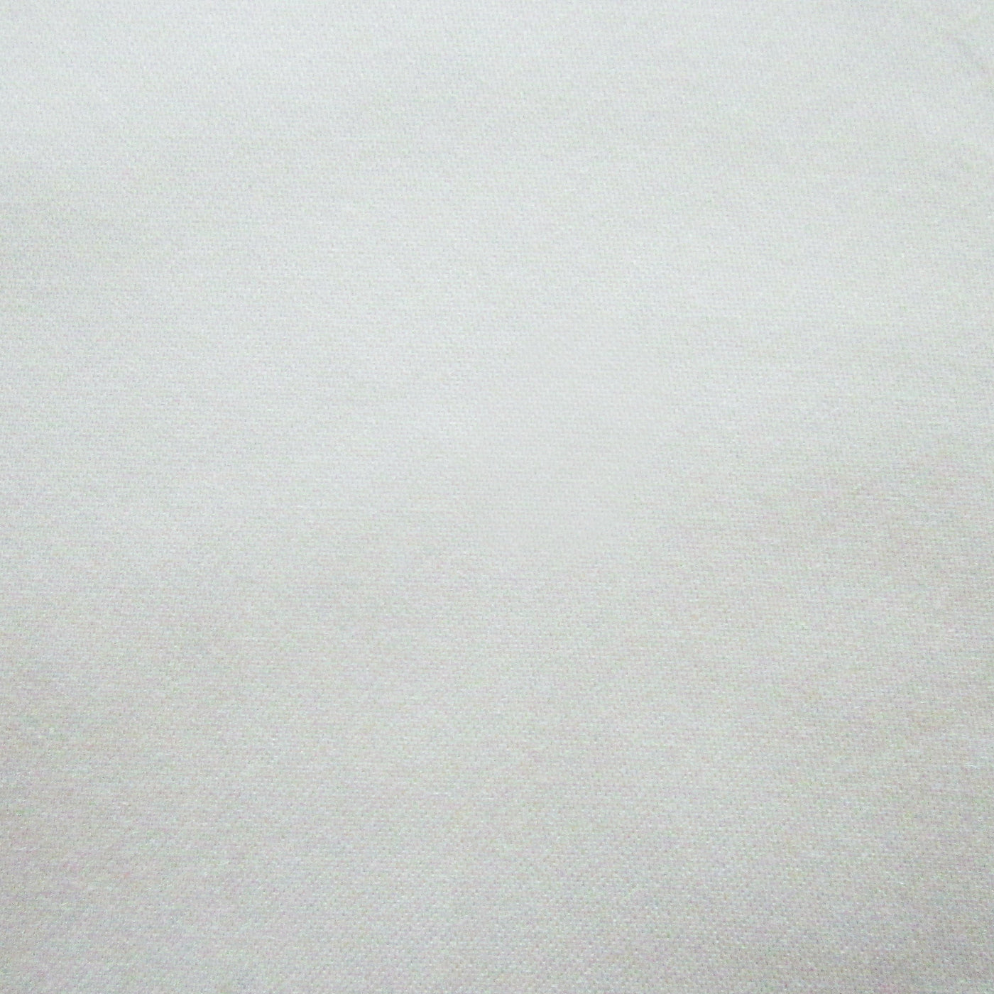 Close-up of ivory linen-weave fabric texture showing fine thread detail.