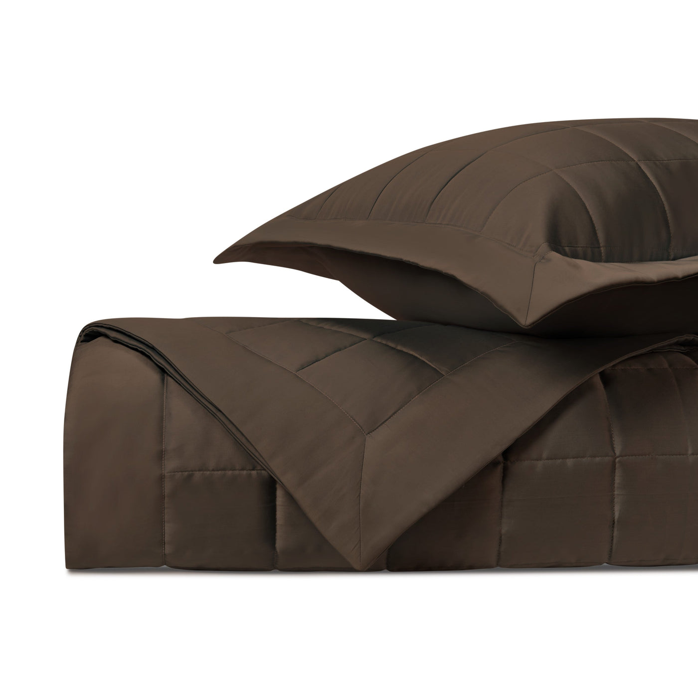 Close-up of Home Treasures Plateau quilted comforter and sham in chocolate brown.