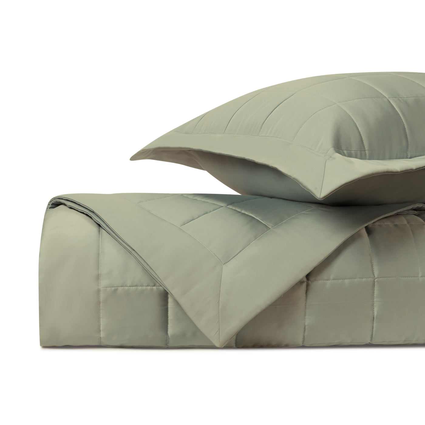 Sage green quilted texture and stitching detail on Plateau comforter and sham.