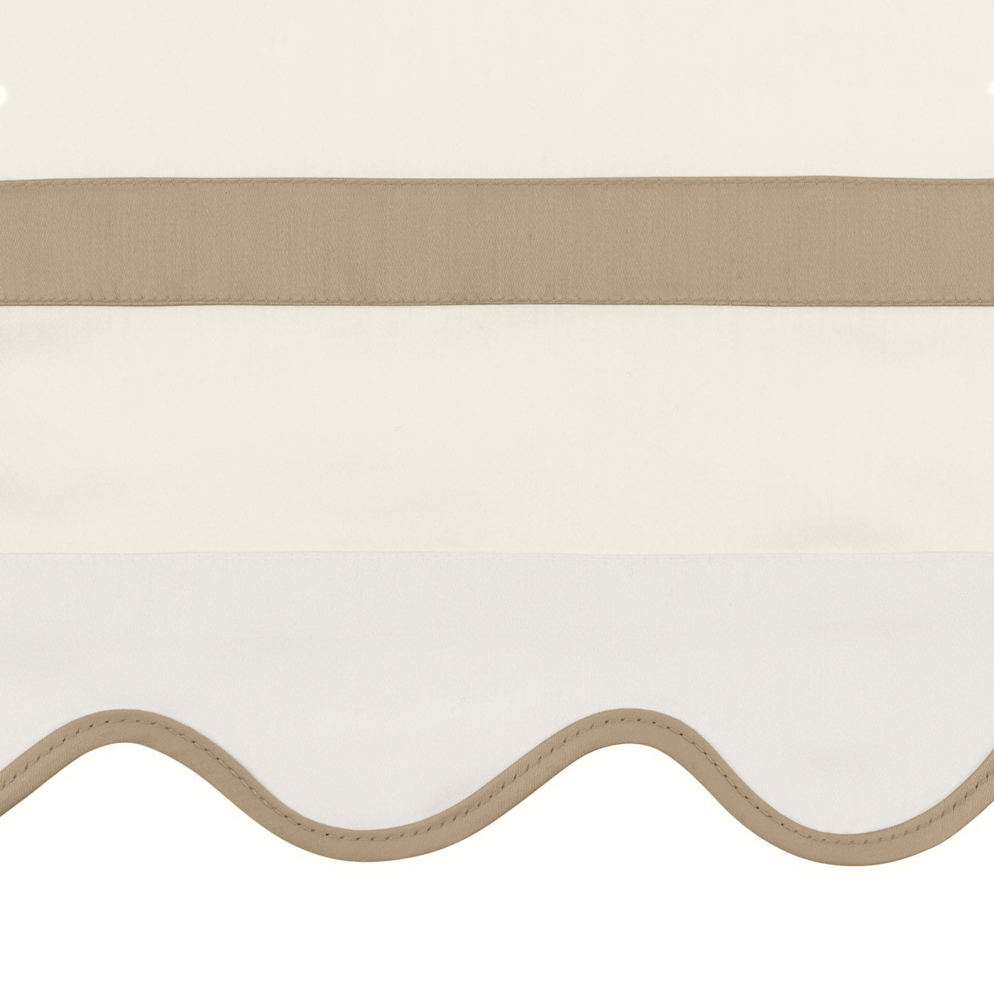 Close-up of ivory pillowcase hem with scalloped edge and taupe trim detail.