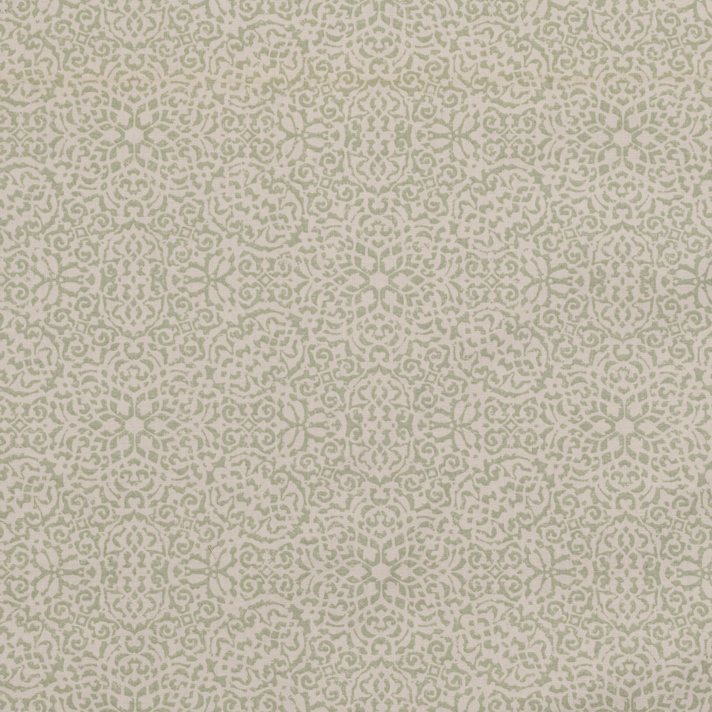 Close-up of ivory linen pillow sham with tone-on-tone floral medallion jacquard pattern.