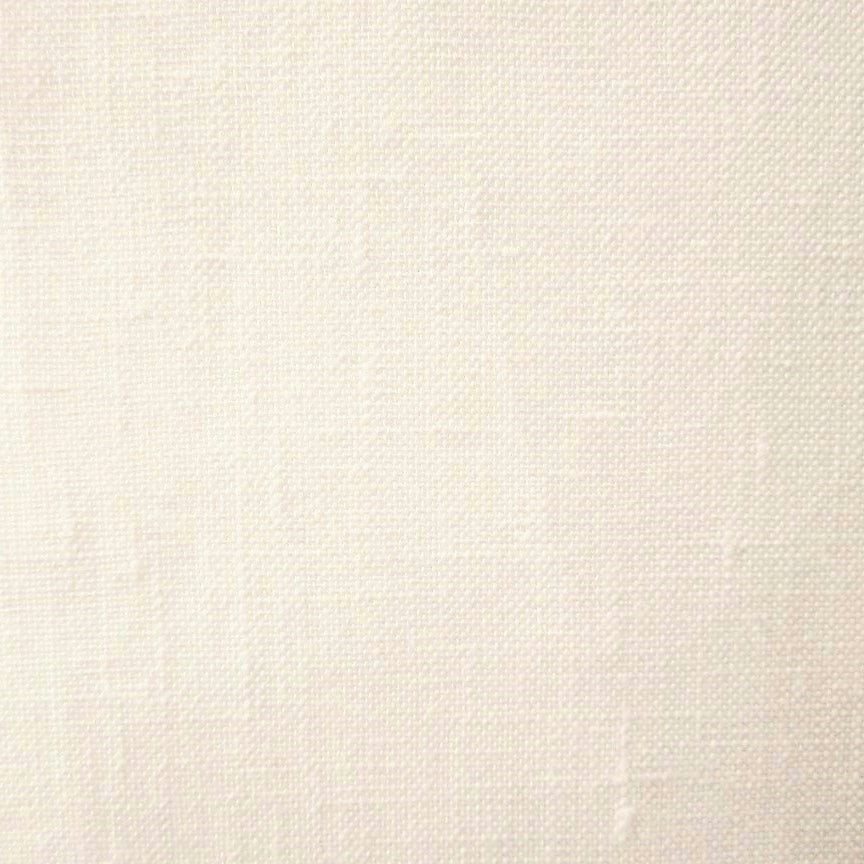 Close-up of ivory woven linen fabric showing open basket weave texture.
