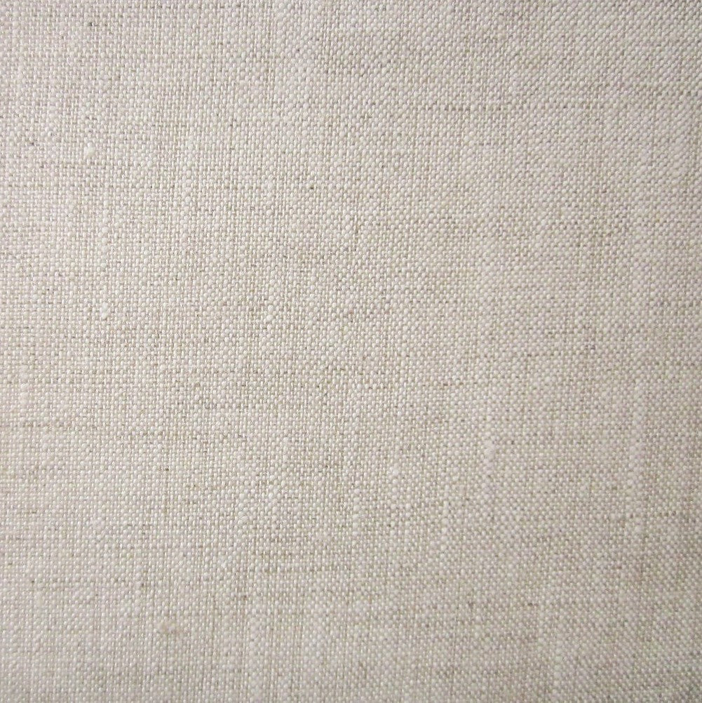 Close-up of natural linen weave texture in warm oat tones.