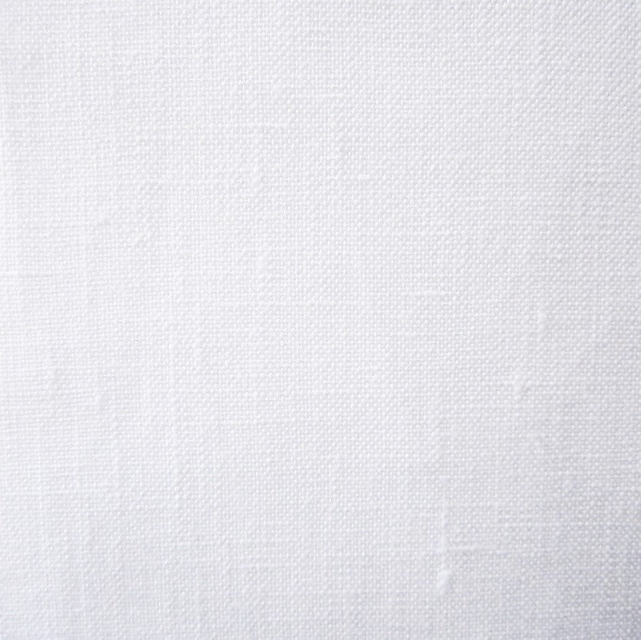 Close-up of white woven linen-look fabric texture, Provenza flat sheet.