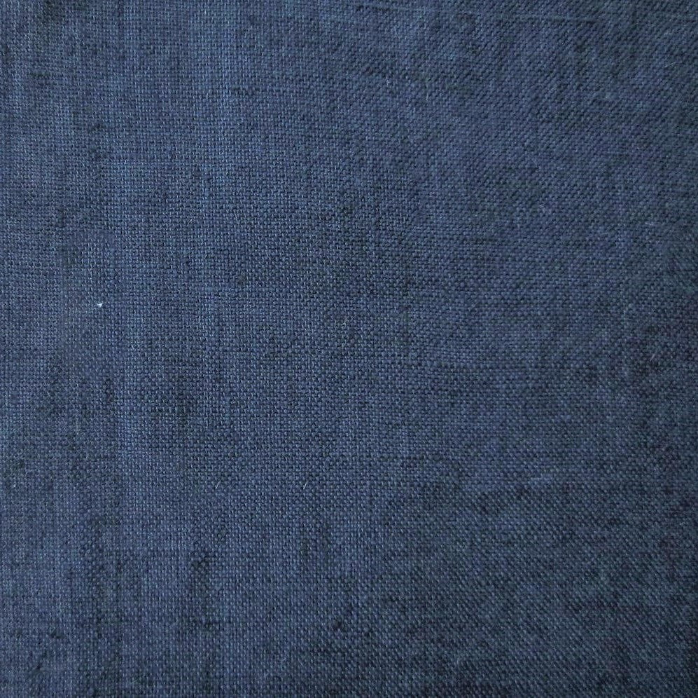 Close-up of Home Treasures Malibu linen fabric in deep navy blue, showing woven texture.