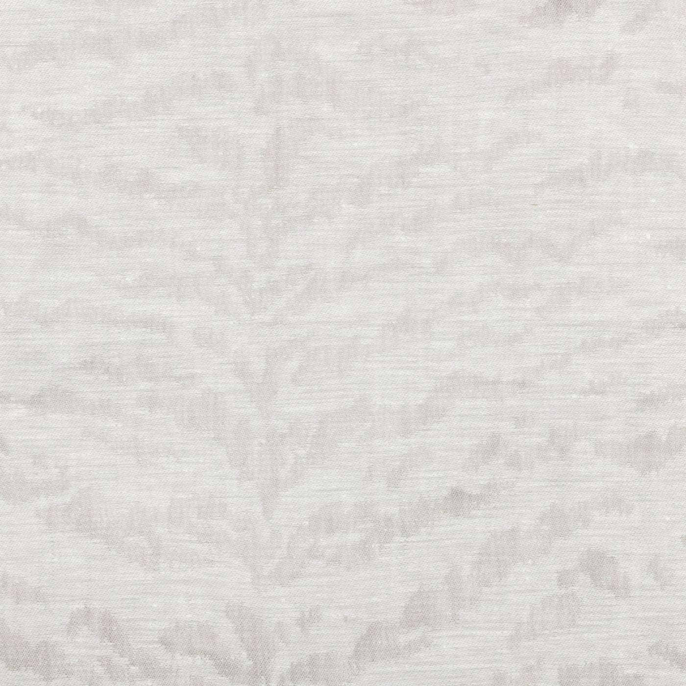 Close-up of ivory woven jacquard fabric with tonal botanical leaf pattern.