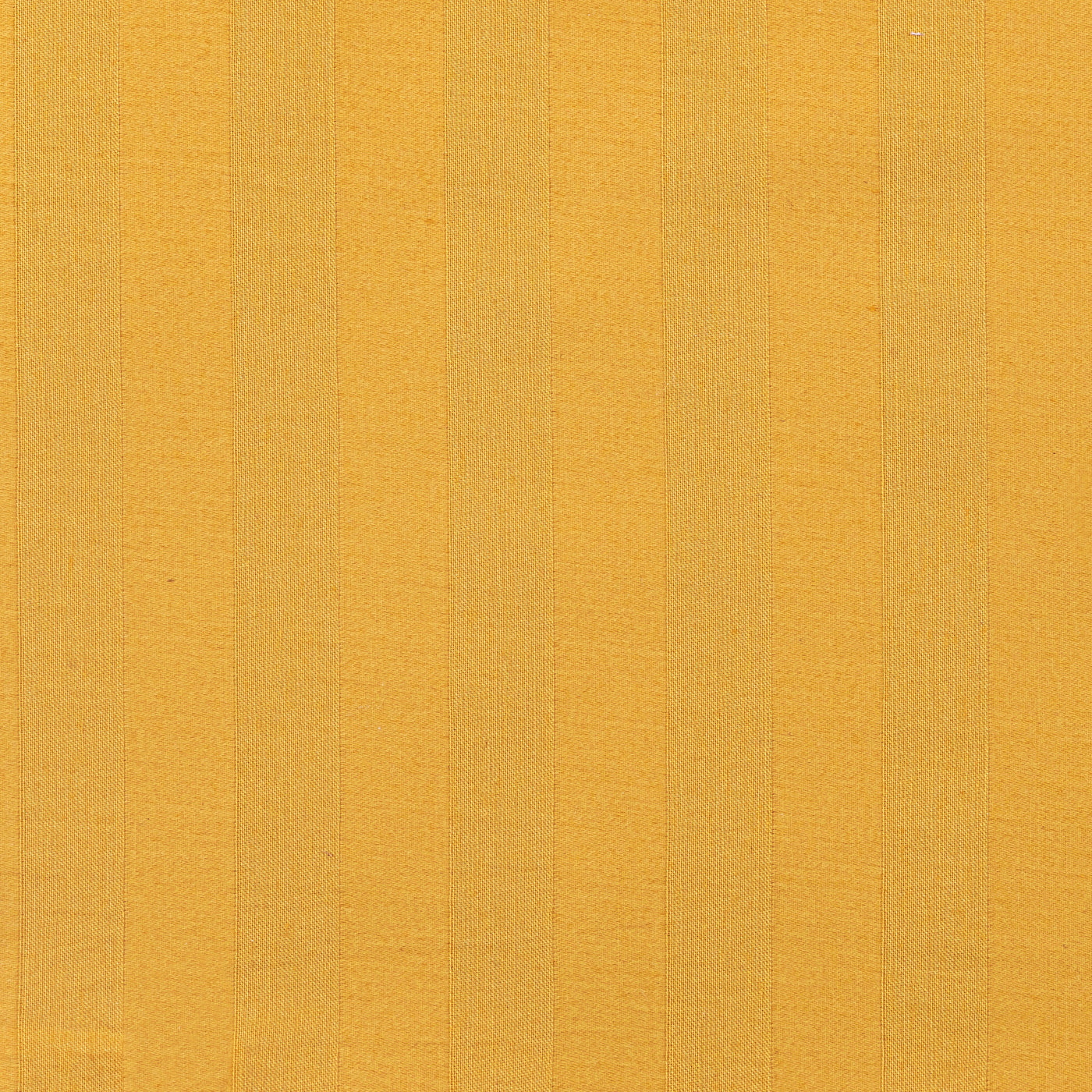 Close-up of saffron cotton fabric with tonal woven stripe texture.