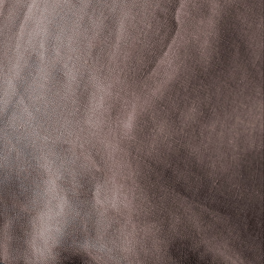 Close-up of Society Limonta Rem linen fabric in muted taupe with soft natural texture.