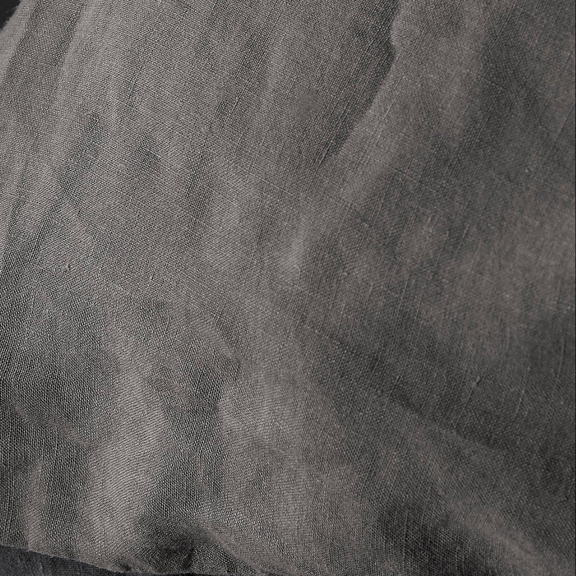 Close-up of Society Limonta Rem duvet cover in charcoal, showing washed linen texture.