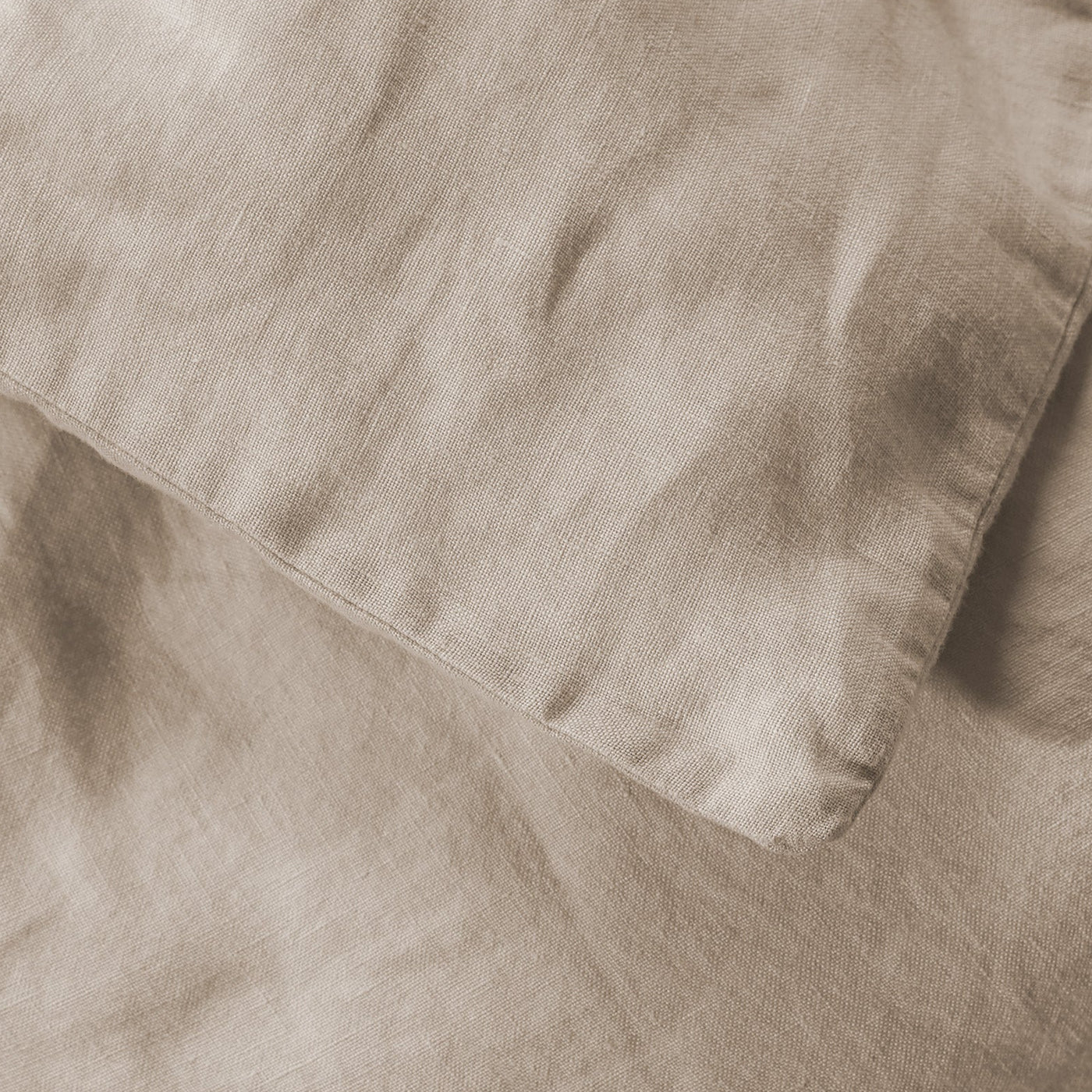 Close-up of Society Limonta Rem duvet cover hem in natural linen weave.