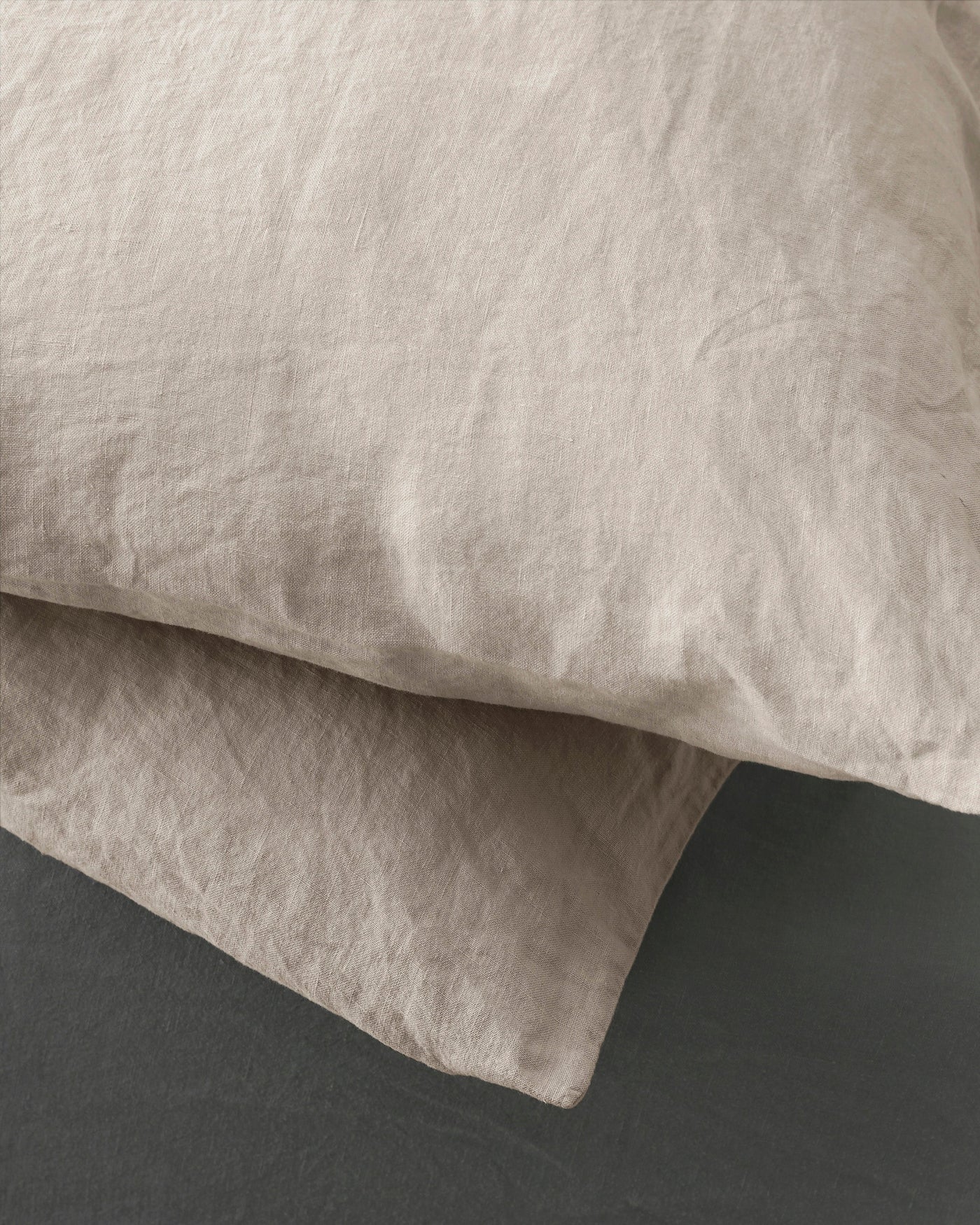 Close-up of Society Limonta Rem pillowcase in oat, showing relaxed linen texture and natural drape.