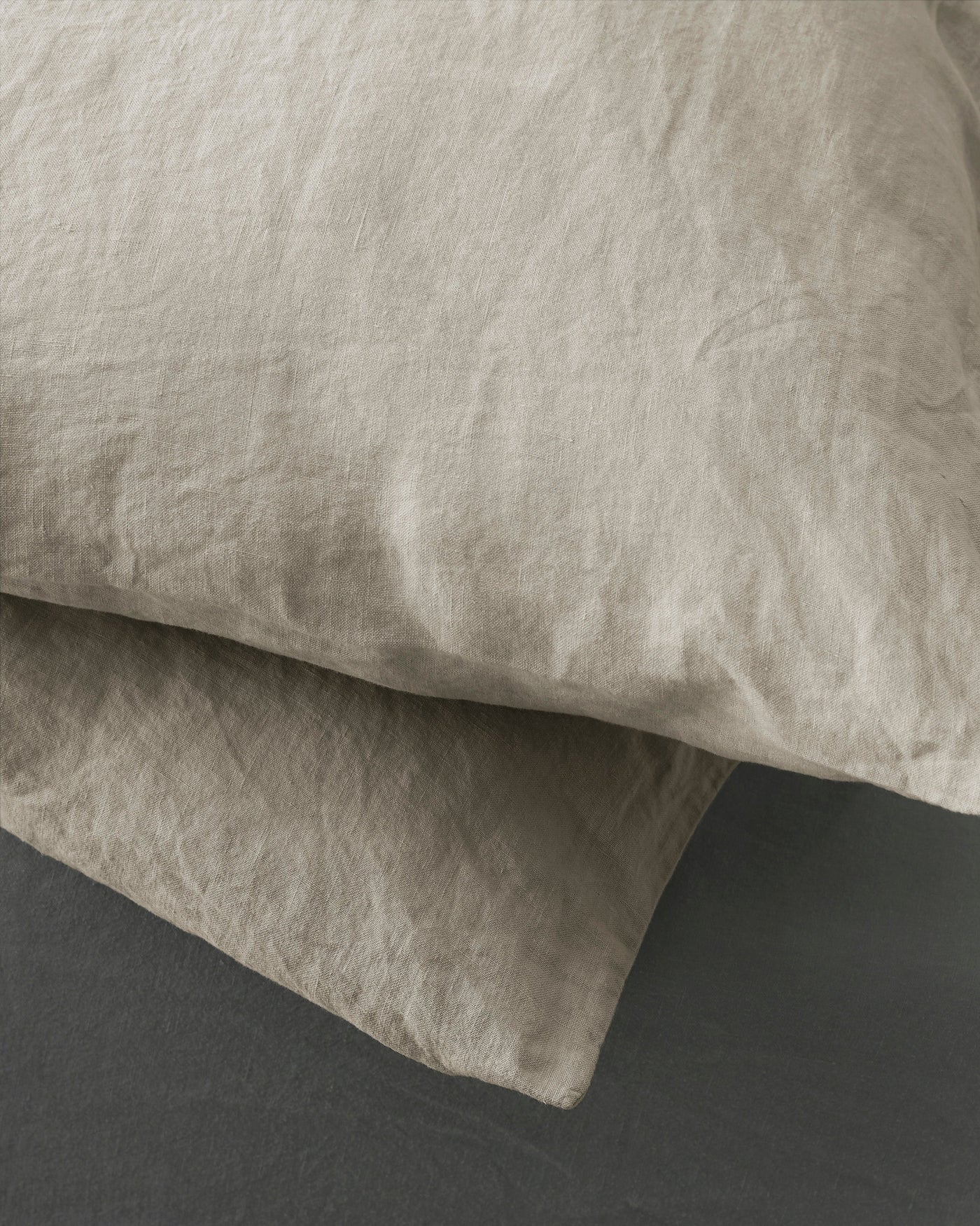 Close-up of Society Limonta Rem pillowcase in natural linen, showing relaxed texture.