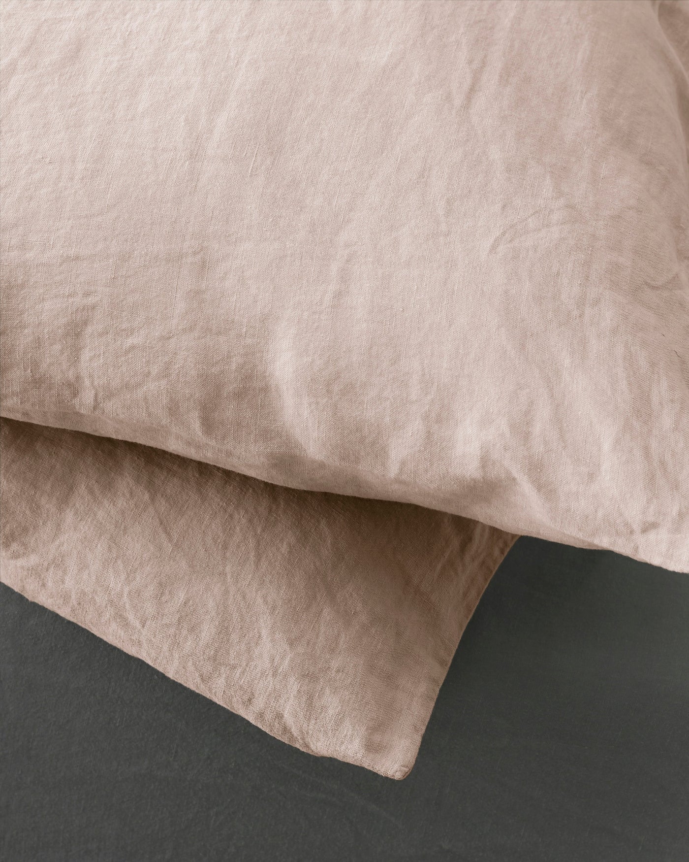 Close-up of Society Limonta Rem pillowcase in blush, showing relaxed linen texture.