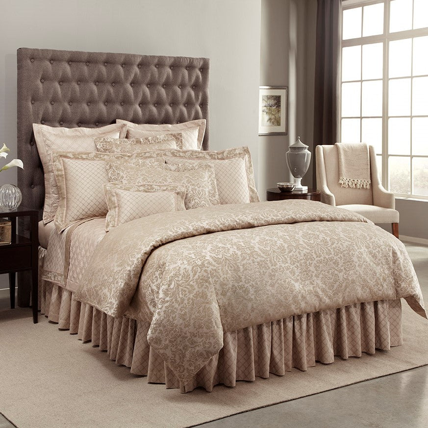 Home Treasures Renaissance champagne damask bedding set styled on a bed.