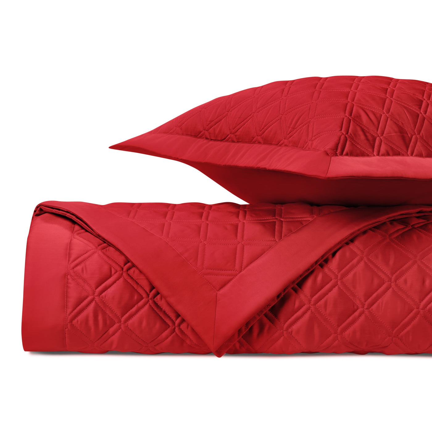 Close-up of crimson quilted diamond stitching pattern on Home Treasures Renaissance coverlet.