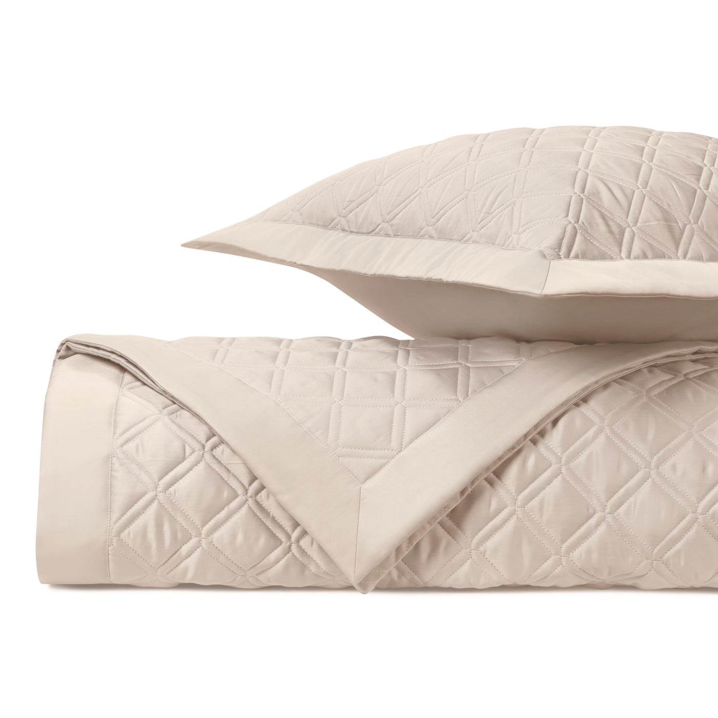 Close-up of Home Treasures Renaissance quilted coverlet in ivory with diamond stitching detail.