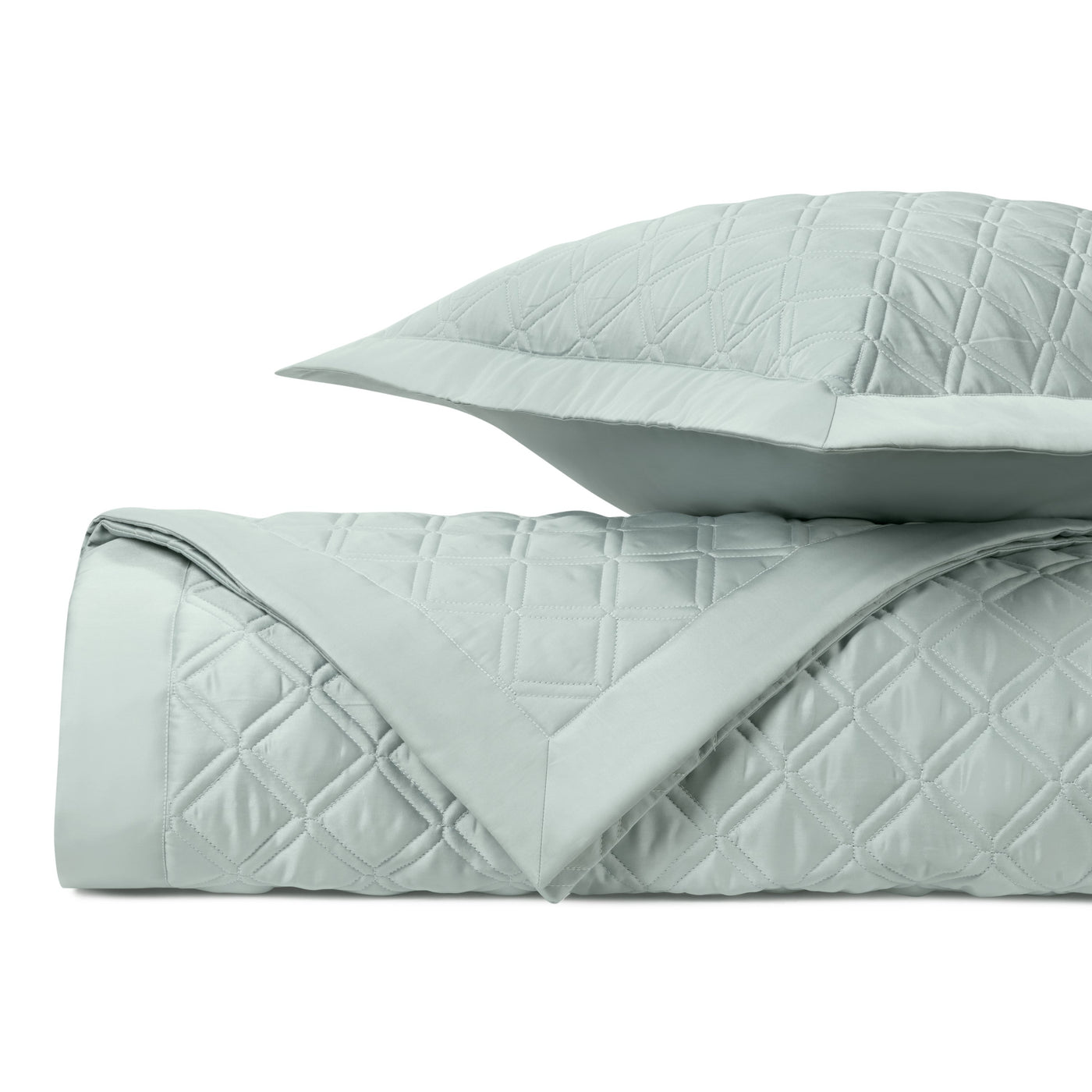 Close-up of Renaissance quilted sham and coverlet in mist, showing diamond stitch pattern.