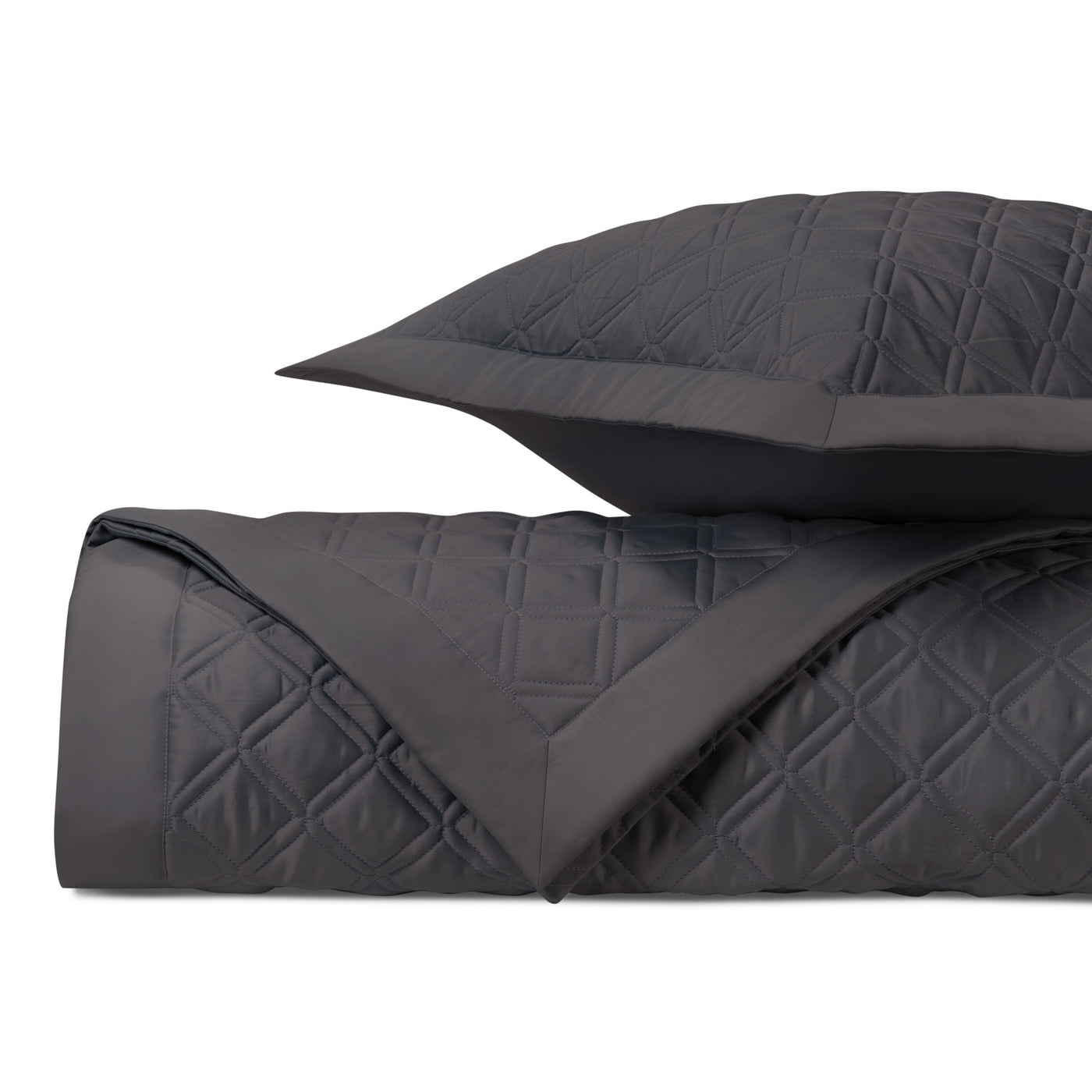 Close-up of charcoal quilted diamond-pattern texture on Home Treasures Renaissance bedding.