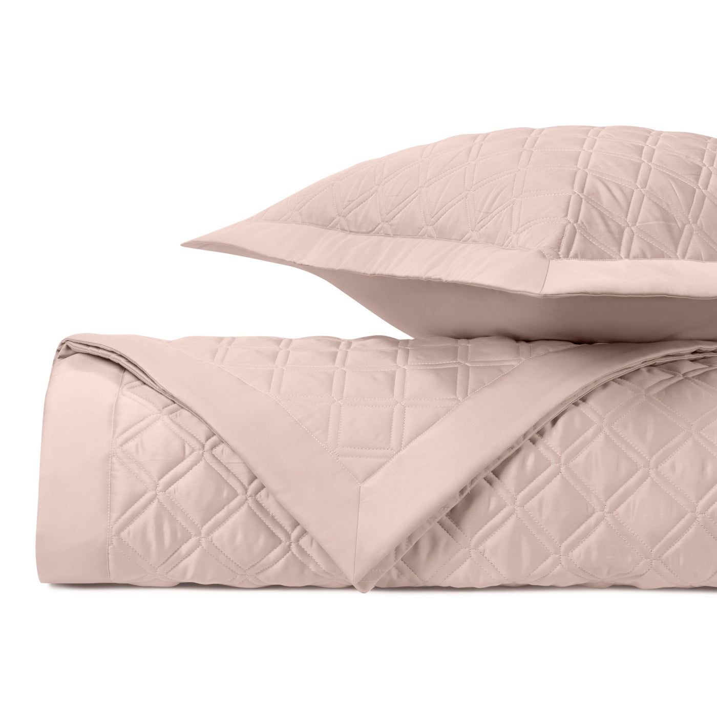 Close-up of Home Treasures Renaissance quilted coverlet in blush with diamond stitching.