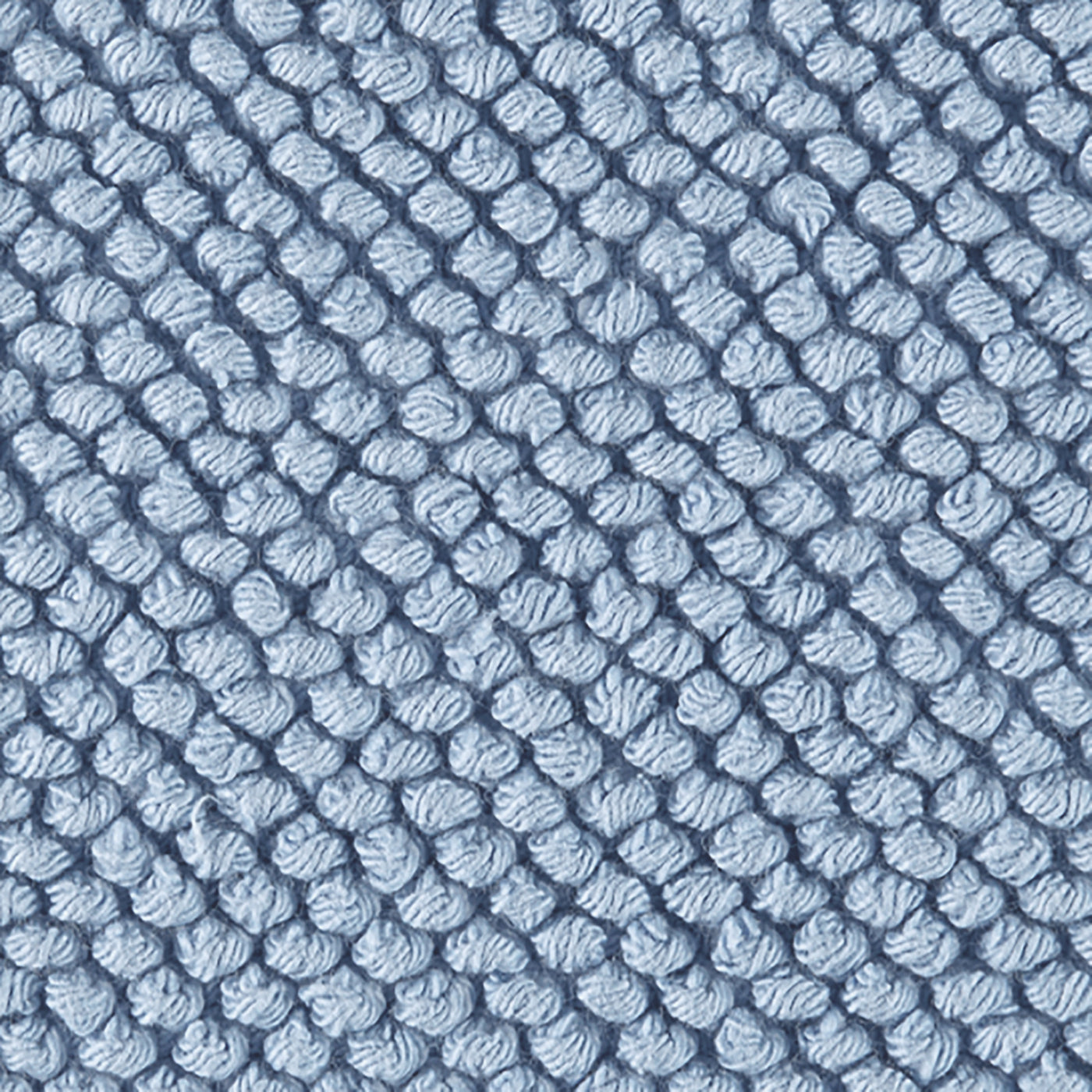 Close-up of Matouk Reverie bath rug in periwinkle blue, showing textured loop weave pattern.