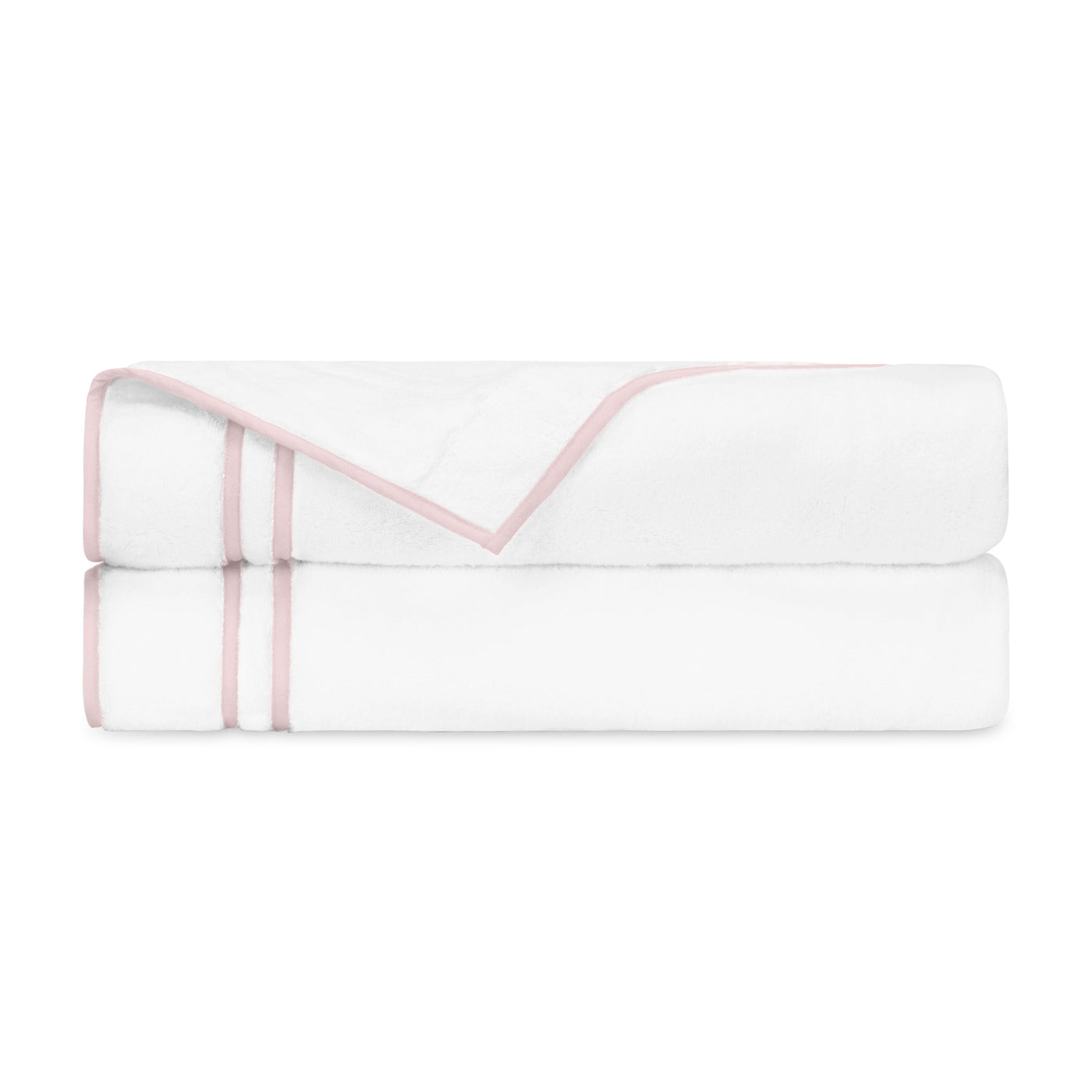Two folded white bath towels with blush double-stripe border trim, neatly stacked.