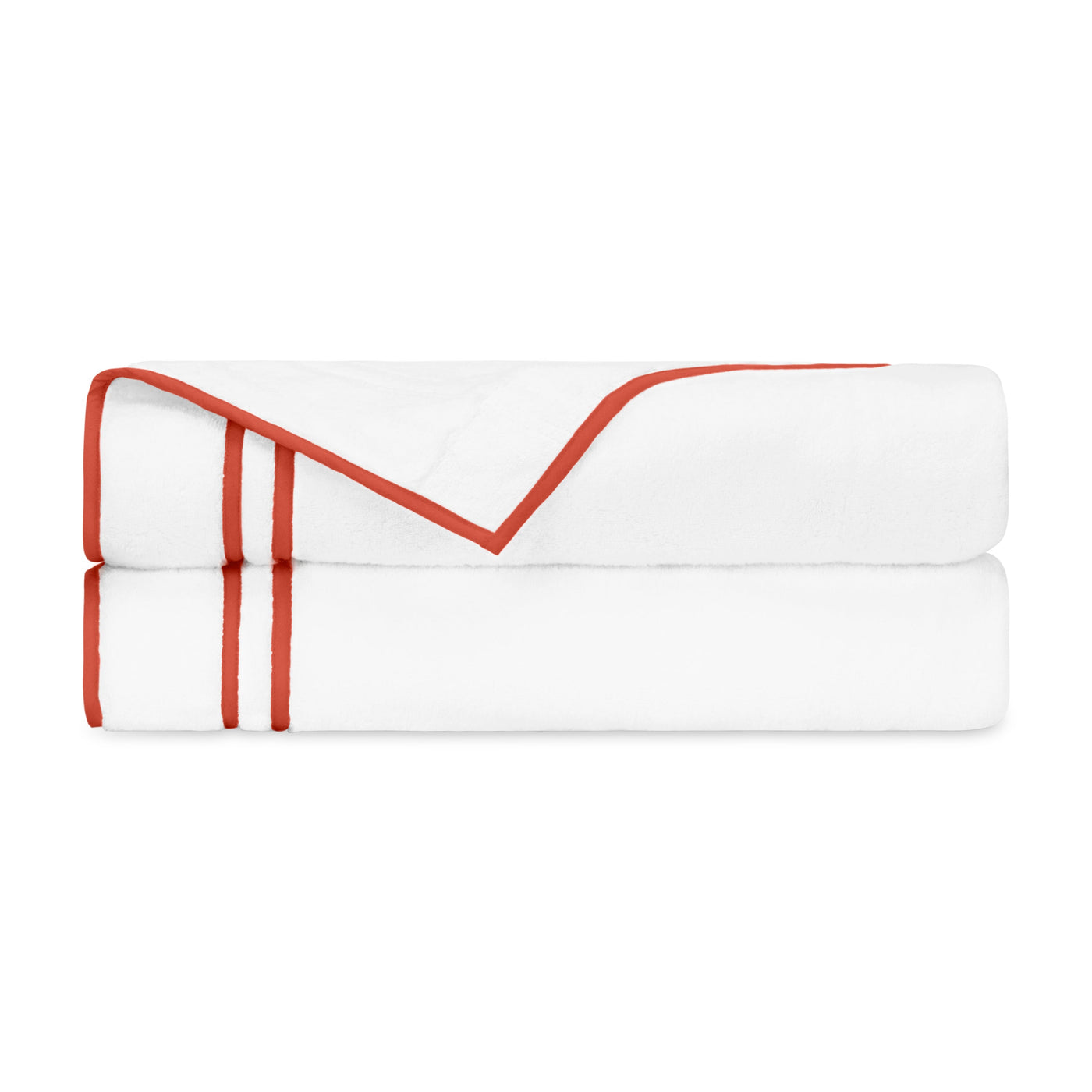 White cotton flat sheets folded with coral ribbon embroidery trim detail.