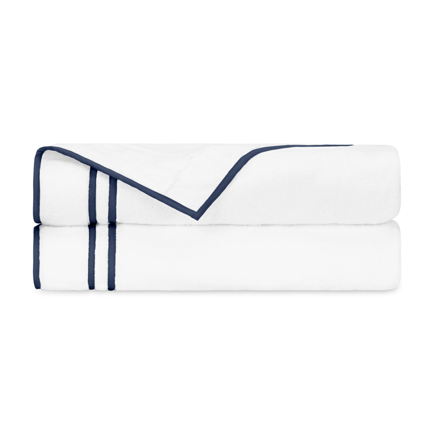 Navy double-line embroidered border detail on white cotton, folded flat sheet close-up.