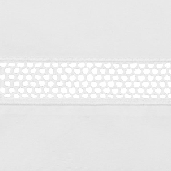 Close-up of Ritz pillow sham white lace trim band with honeycomb cutwork detail.