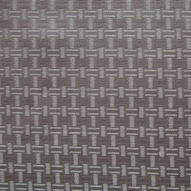 Close-up of Roberto's slate jacquard weave with geometric basketweave pattern.