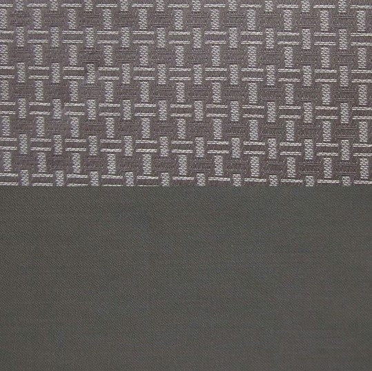 Close-up of charcoal Roberto fabric showing woven basketweave texture against smooth solid border.