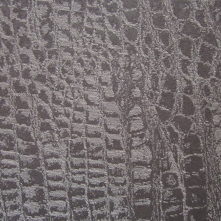 Close-up of Home Treasures Roberto fabric in charcoal with woven crocodile texture.