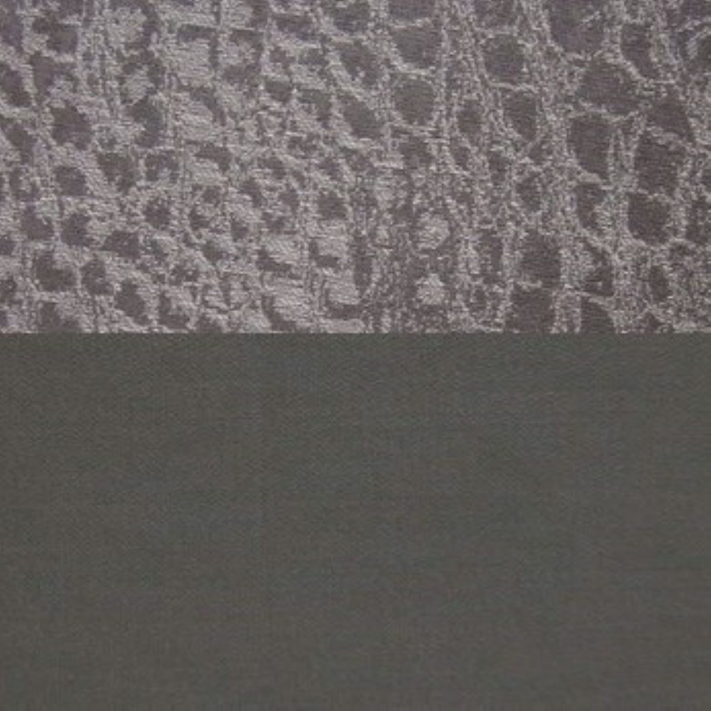 Close-up of slate Roberto sham showing textured jacquard weave above smooth linen border.