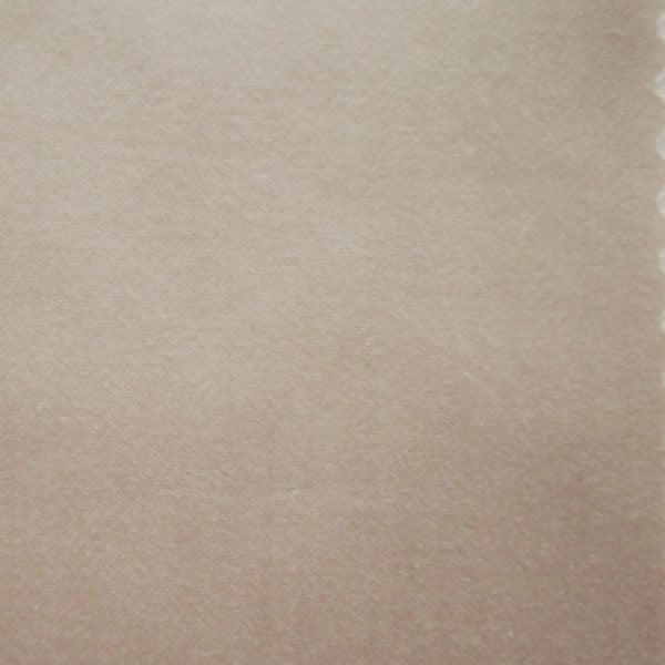 Warm sand cotton fabric close-up with fine, even weave texture.