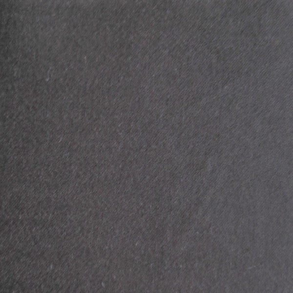 Close-up of charcoal sateen fabric showing subtle diagonal weave texture.