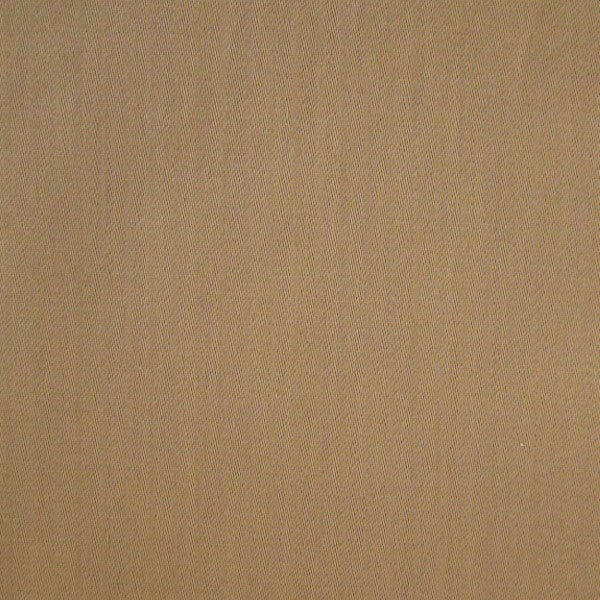 Close-up of camel-toned woven fabric texture on the Firenze quilted coverlet.