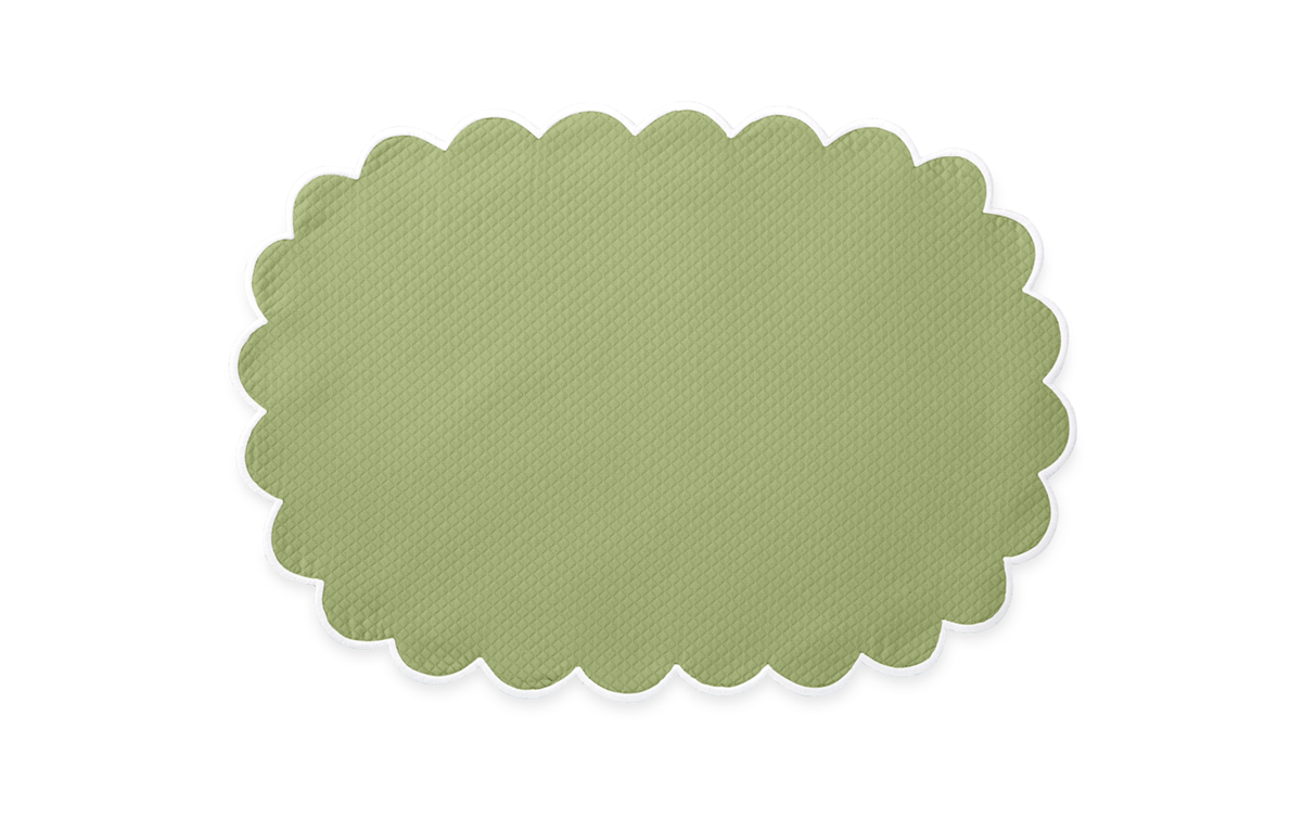 The Savannah Gardens Placemat Set by Matouk features light green, oval-shaped placemats with scalloped edges and a subtle diamond pique texture, displayed on a plain white background.