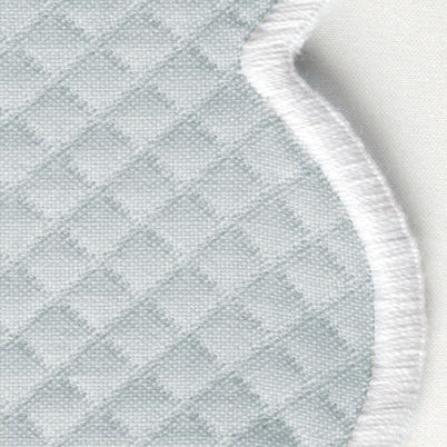 Close-up of the Savannah Gardens | Napkin Set by Matouk, featuring light blue diamond pique fabric with a diamond pattern and a white stitched edge.